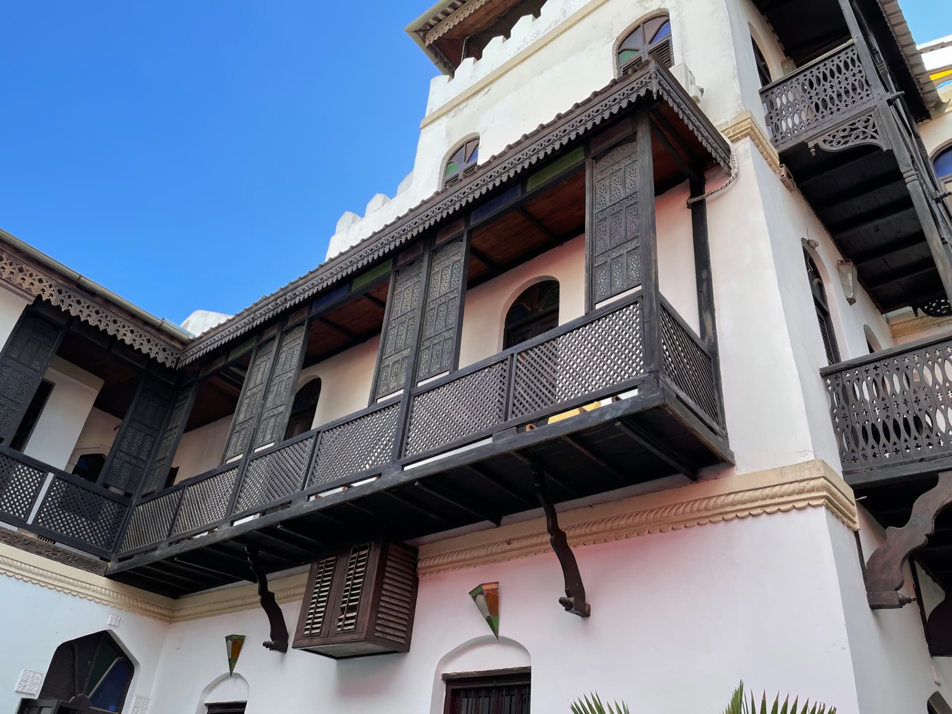 Carved wooden balconies of a historic Stone Town building in Zanzibar