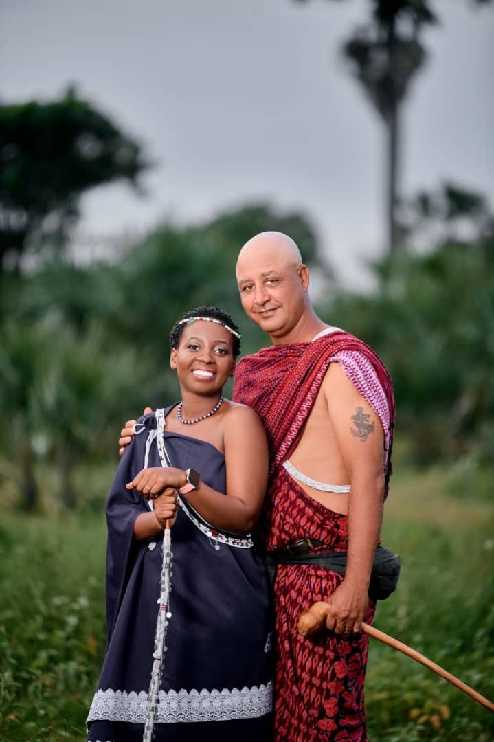 Mike Fritsi and Schola in traditional Tanzanian dress, welcoming guests to Mike's Beach Cottages